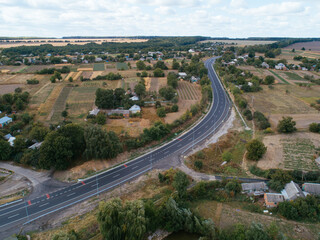 Aerial view asphalt road and green forest, Forest road going through forest with car adventure view from above, Ecosystem and ecology healthy environment concepts and background.