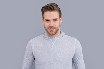 Portrait of man. Young man with unshaven face. Handsome man studio. Caucasian man in casual