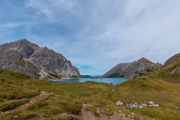 Lünersee in the Austrian Alps with snowy slopes