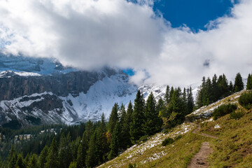 Fototapeta na wymiar A cloudy day with snowy mountains (Vorarlberg, Austria)