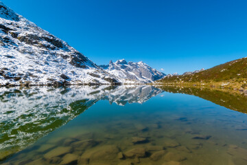 Naklejka na ściany i meble calm tarn with the reflections of the surrounding peaks (Tobelsee, Vorarlberg, Austria)