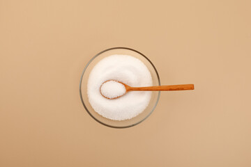Stevia sweetener or Stevioside crystal white powder in glass plate, top view. Natural Extract...