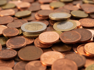 Lots of metal coins. A bunch of euro cents.