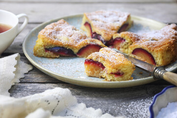 Homemade plum pie and cup of tea. New York Times recipe plum cake