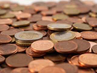Lots of metal coins. A bunch of euro cents.
