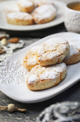 Ricciarelli,  gluten free almond cookies. Italian traditional Christmas cookies and coffee. New year decor