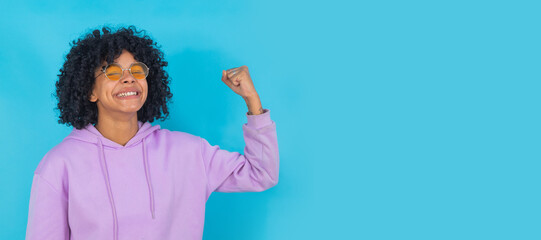 isolated afro girl with expression of strength and power