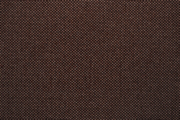 Texture and background of upholstery fabric in dark burgundy color. Fabric sample texture as...