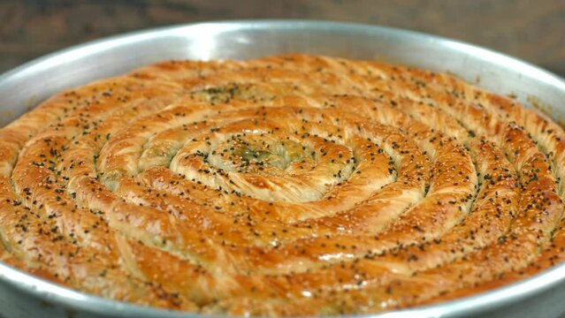 Turkish traditional pastry, Su b&ouml;reği, Karak&ouml;y B&ouml;reği, Karakoy b&ouml;regi, su boregi, Turkish Su Boregi pie, Tabla borek or burek in plate. Bosnak boregi, gocmen boregi, kapali pide, pide, kıymalı borek, 