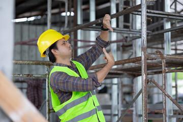 Naklejka na ściany i meble construction workers at construction site