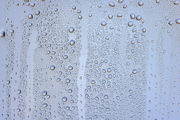 drops glass blue background abstract, transparent cold background water splashes