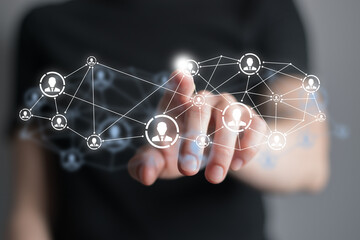 Human resources manager pointing at virtual network chain with person icons. Human capital and teambuilding concept.