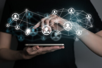 Human resources manager pointing at virtual network chain with person icons. Human capital and teambuilding concept.