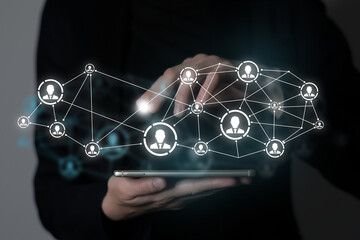 Human resources manager pointing at virtual network chain with person icons. Human capital and teambuilding concept.