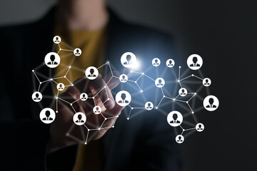 . Virtual visualization of network chain with person icons, female unrecognised manager on background. Human capital and teambuilding concept.