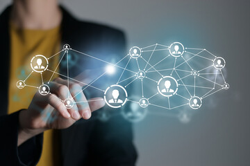 Human resources manager pointing at virtual network chain with person icons. Human capital and teambuilding concept.