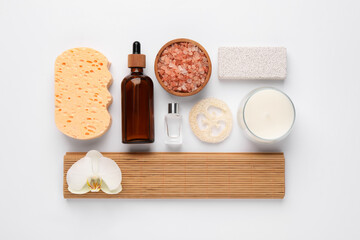 Flat lay composition with different spa products on white background