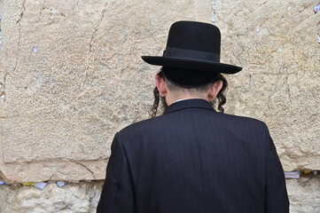 Orthodox Jewish man pray at the Western Wall Jerusalem Israel