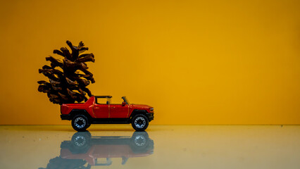 Minahasa, Indonesia : December 2022, the toy car transporting pinecones