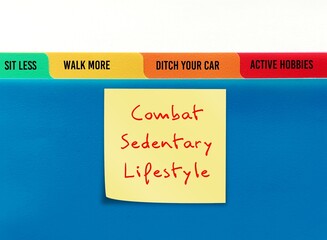 Handwritten stick note on blue folder COMBAT SEDENTARY LIFESTYLE , to overcome being couch potato...