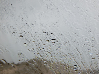 Raindrops on glass.