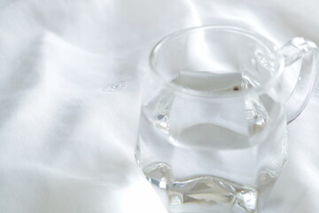 clear glass in water white background blank space crystal clear water shine