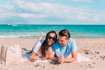 Fototapeta premium Young couple spending time together on the beach