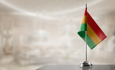 A small Bolivia flag on an abstract blurry background