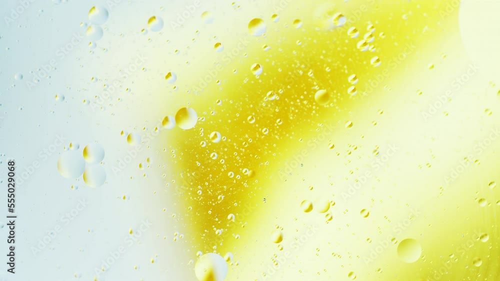 Poster real close up oil bubbles in water rotation with color gradient abstract mixing background.