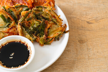 Pajeon or Korean pancake and Korean Kimchi pancake or Kimchijeon on white background