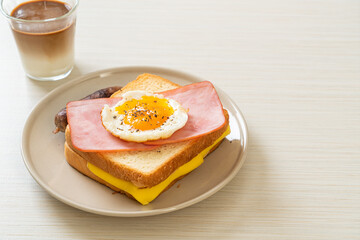 bread toasted cheese topped ham and fried egg with pork sausage