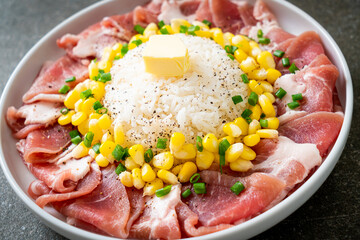 fresh pork raw sliced with rice and corn on plate and ready to cook