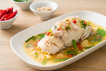 steamed sea bass fish with herbs