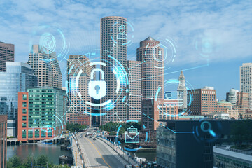 Panorama city view of Boston Harbor at day time, Massachusetts. Building exteriors of financial downtown. Glowing Padlock hologram. Concept of cyber security to protect confidential information