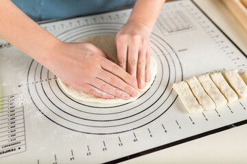Using the kitchen silicone baking mat in the cooking process.