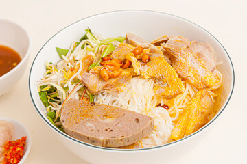 Bun mam nem, Vietnamese rice noodle with pork and fermented anchovy dipping sauce, Vietnamese food isolated on white background, close-up