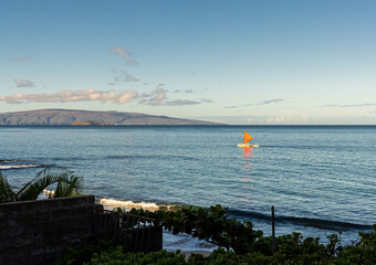 Outrigger Canoe Sailing Along The Shore Of Polo Beach, Wailea, Maui, Hawaii, USA
