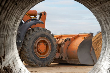 The front loader picks up gravel or crushed stone in the front bucket. Heavy construction machinery...