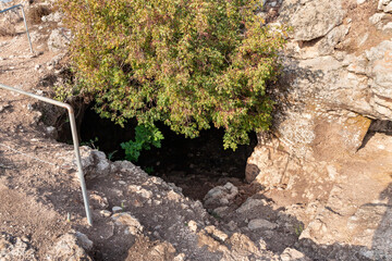 The entrance  to the cave where the primitive people lived in Tel Yodfat National park, in northern Israel