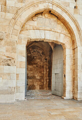 View of the Jaffa Gate in Jerusalem. The old gate has the shape of a medieval gate tower with an L-shaped entryway, which was secured at both ends with heavy doors