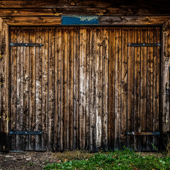 The faded gate of an old wooden house.