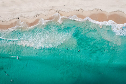 Top down view of the waves breaking on Trigg Beach in Perth, Western Australia