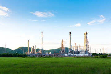 Fototapeta na wymiar Oil refinery and petroleum at green field