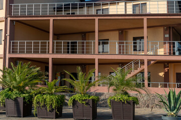 Facade of a hotel building with balconies.