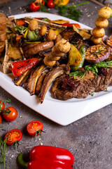 A set of various beef meat dishes on a white plate