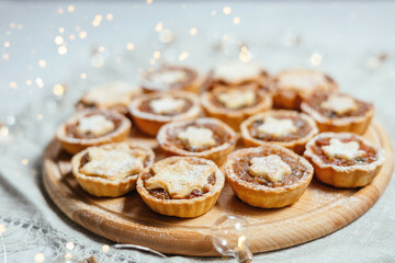 Christmas mince pies with fruit filling on a gray background.