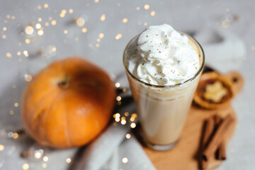 Pumpkin spicy latte on a gray background.