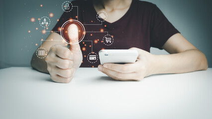 Person touching screen to fingerprint scanner, security access information, big data management concept, Internet of things, cloud computing, internet connection, shopping online and cashless society.