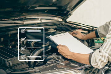 Auto mechanic checking car engine checking for engine repair, auto service and maintenance...