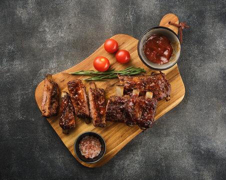 Delicious BBQ ribs. Smoked American style pork ribs with souce.